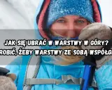 Osoba w zimowej kurtce i czapce z kapturem, z kijkami trekkingowymi. Wskazówki, jak się ubrać w góry jesienią, by warstwy działały razem.